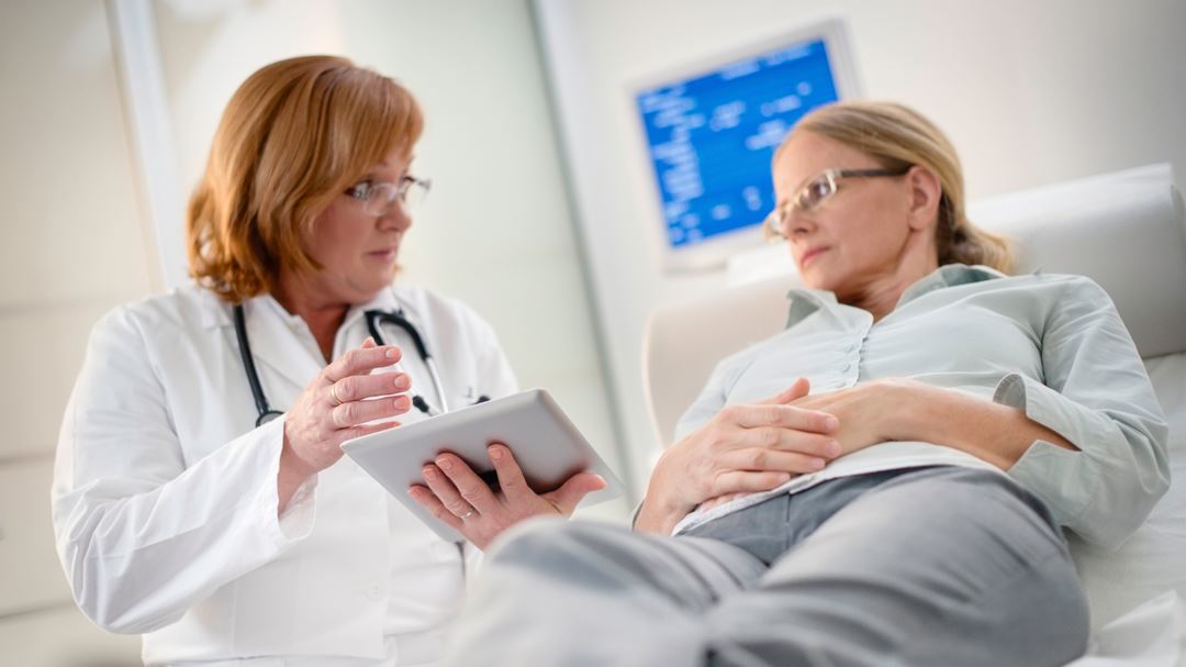 doctor speaking to a woman patient