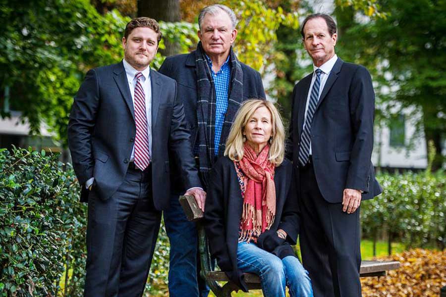 Featured in the New York Times – Attorneys Brent Wisner and Michael Baum in Brussels with clients John Barton and Teri McCall