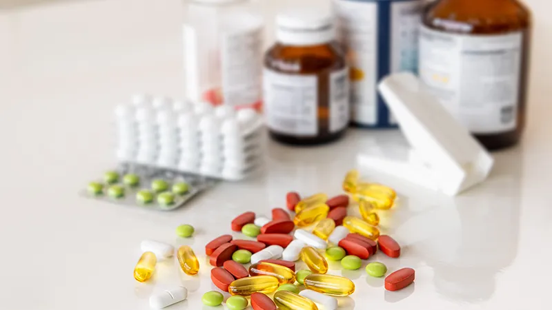 A bottles and a capsules of medicine.