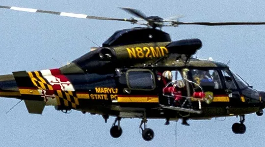 A helicopter up in the sky.
